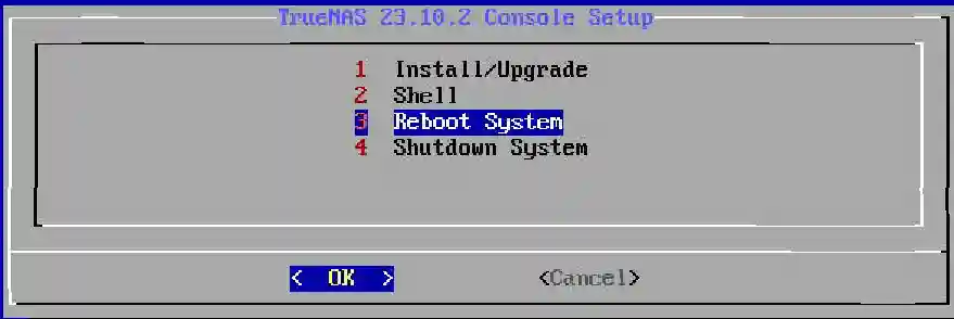 The image displays a final message in the TrueNAS installation process indicating a successful installation on 'sdg sdm'. Users are instructed to 'Please reboot and remove the installation media.' The confirmation message is set against a grey dialog box, with an 'OK' button below indicating the next step to finalize the process and restart the system.