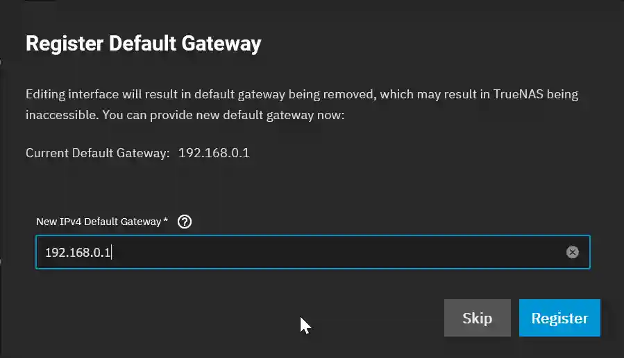 TrueNAS SCALE notification for registering a new default gateway, with fields showing the current and the option to input a new IPv4 default gateway address.