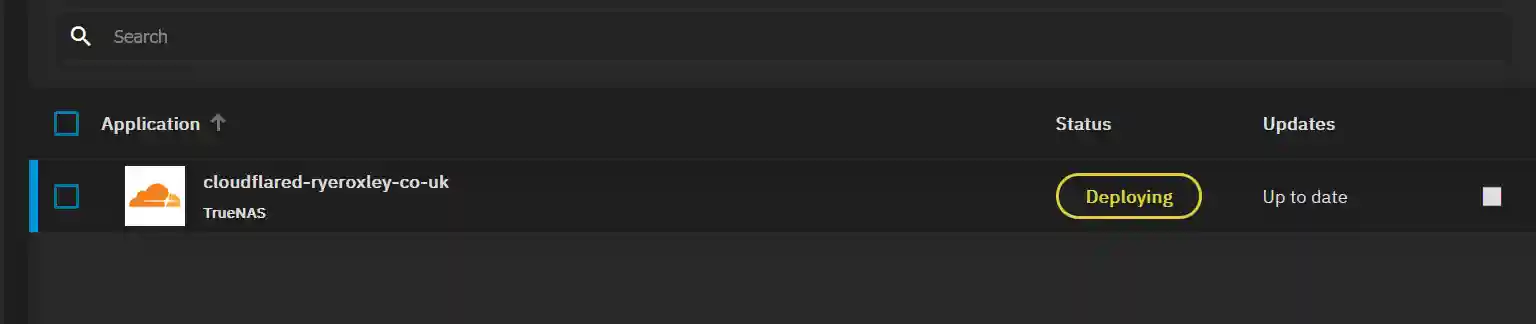 The application 'cloudflared-ryeroxley-co-uk' from TrueNAS is currently deploying, with the status highlighted in yellow, and marked as 'Up to date'.