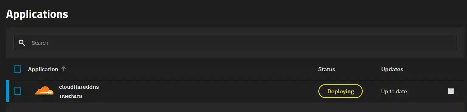 A dark-themed applications management interface displaying a single entry: 'cloudflarededdns' by Truecharts, with a status indicating it is currently being deployed and an 'Up to date' label under Updates.